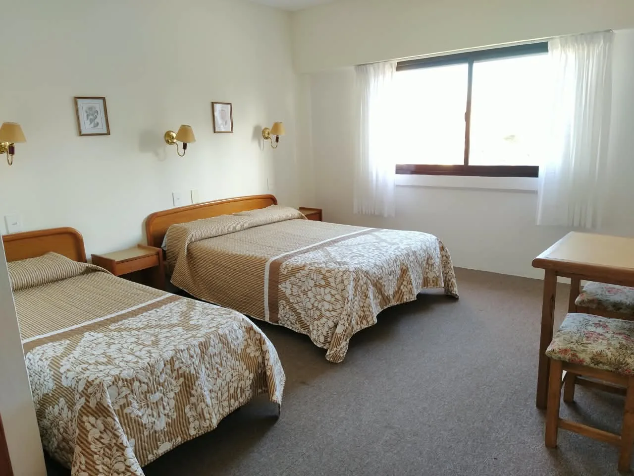 Bright family room with three beds